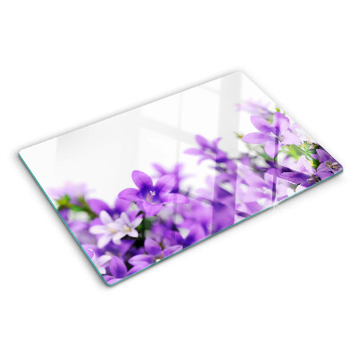 Glass cutting board Purple flowers in the background