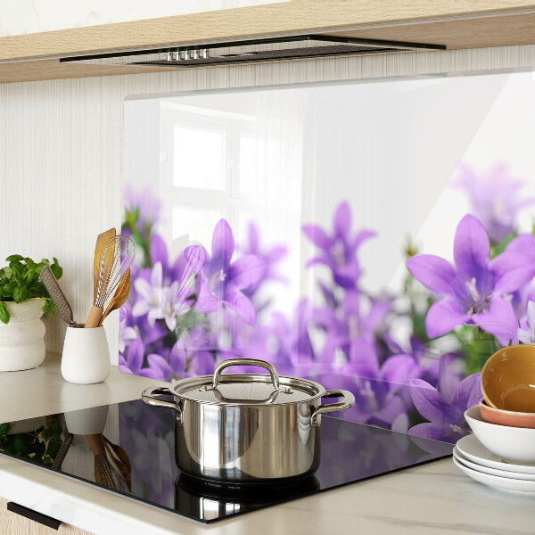 Glass cutting board Purple flowers in the background