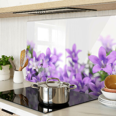 Glass cutting board Purple flowers in the background