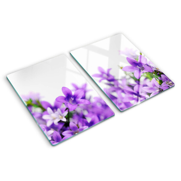 Glass cutting board Purple flowers in the background