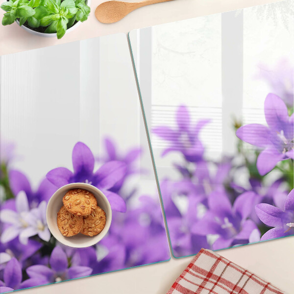 Glass cutting board Purple flowers in the background