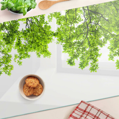 Glass kitchen board Green leaves against the sky
