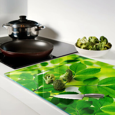 Cutting board Leaves on a green background