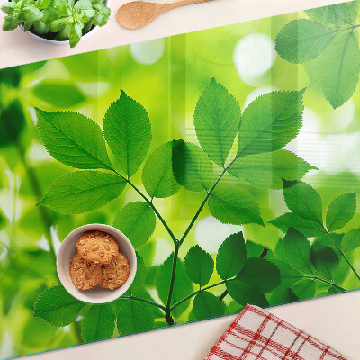 Cutting board Leaves on a green background