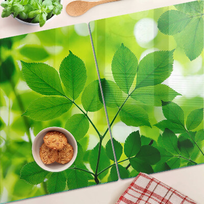 Cutting board Leaves on a green background