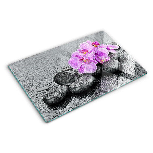 Cutting board Flowers and stones against the water background