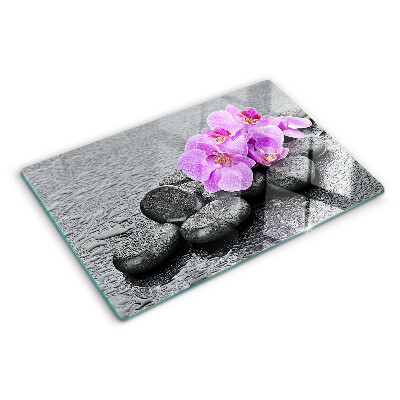 Cutting board Flowers and stones against the water background