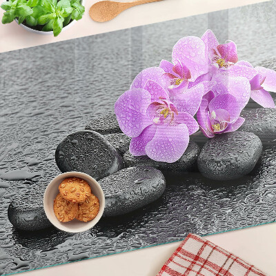 Cutting board Flowers and stones against the water background