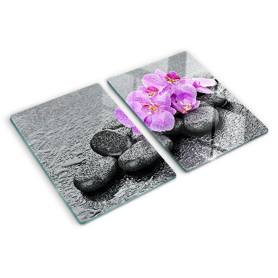 Cutting board Flowers and stones against the water background