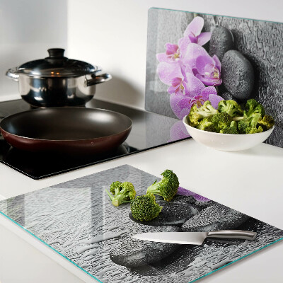 Cutting board Flowers and stones against the water background