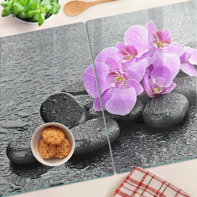 Cutting board Flowers and stones against the water background