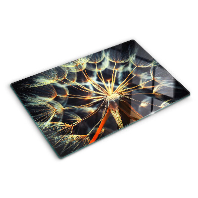 Chopping board glass Dandelions in macro photography
