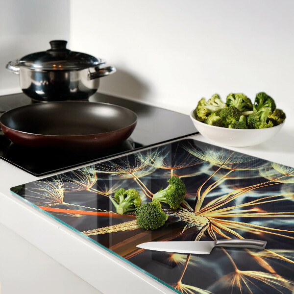 Chopping board glass Dandelions in macro photography