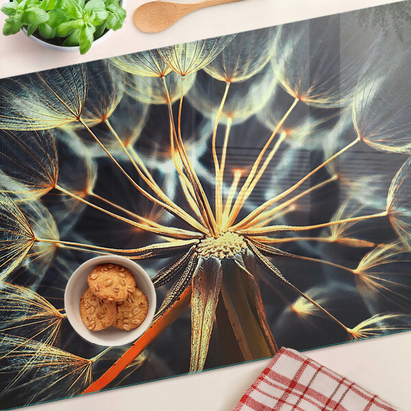 Chopping board glass Dandelions in macro photography