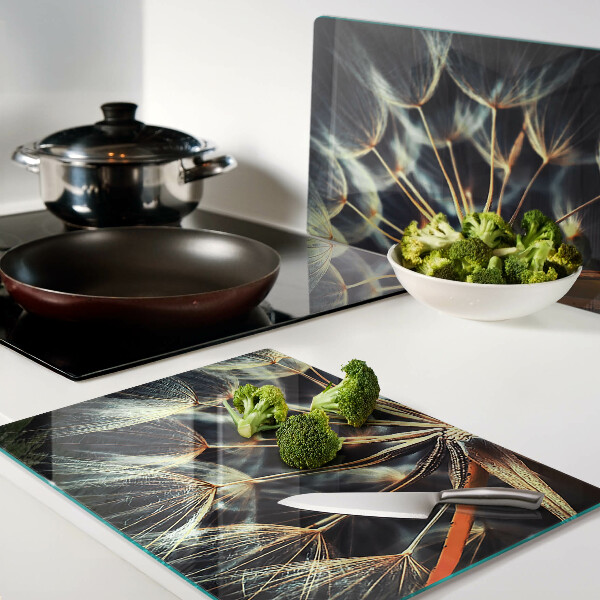 Chopping board glass Dandelions in macro photography