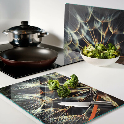 Chopping board glass Dandelions in macro photography