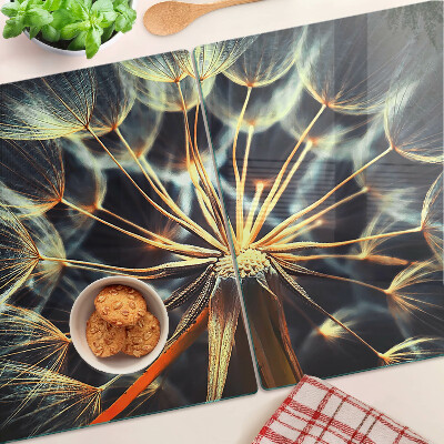 Chopping board glass Dandelions in macro photography