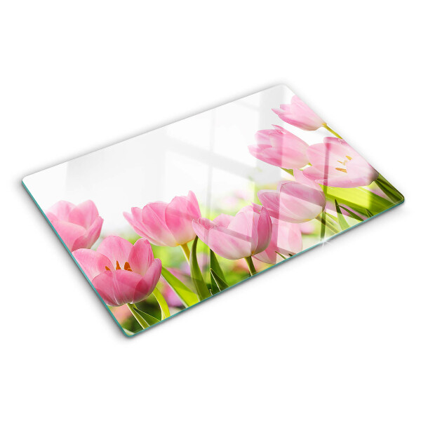 Glass kitchen board Pink tulips in the garden