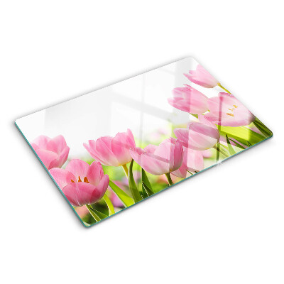 Glass kitchen board Pink tulips in the garden