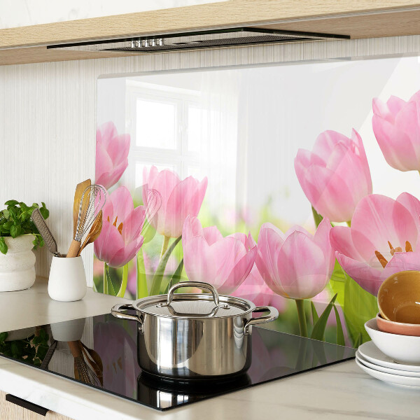 Glass kitchen board Pink tulips in the garden