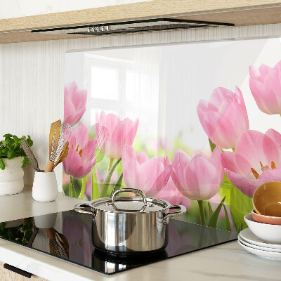 Glass kitchen board Pink tulips in the garden