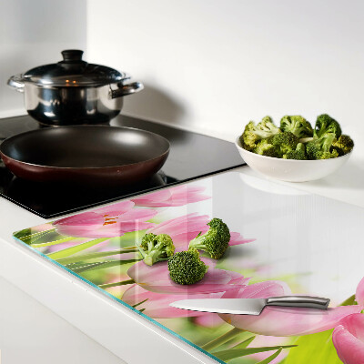 Glass kitchen board Pink tulips in the garden