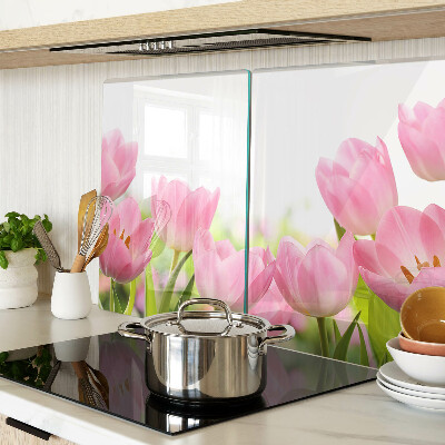 Glass kitchen board Pink tulips in the garden