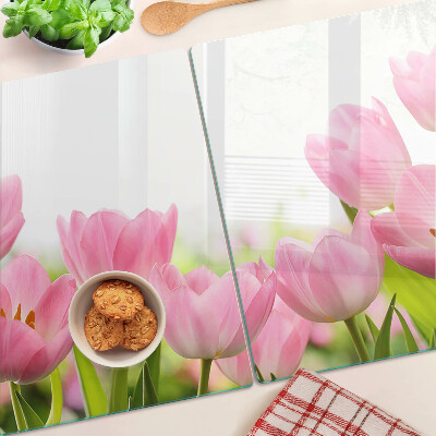 Glass kitchen board Pink tulips in the garden
