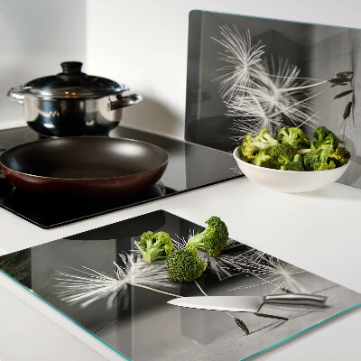 Glass cutting board Fluffy dandelions on a monochromatic background
