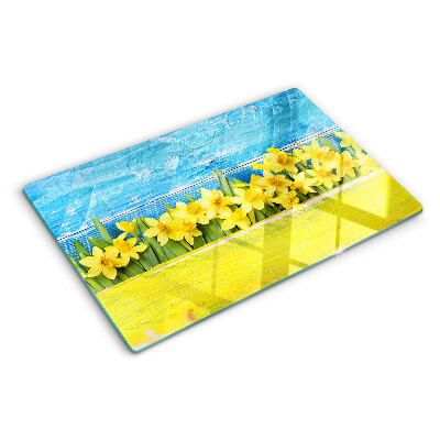 Glass kitchen board Daffodil flowers against the sky