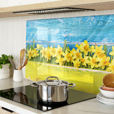 Glass kitchen board Daffodil flowers against the sky