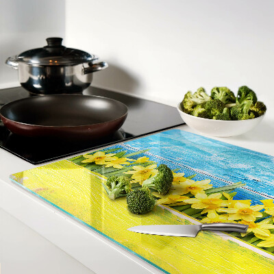Glass kitchen board Daffodil flowers against the sky
