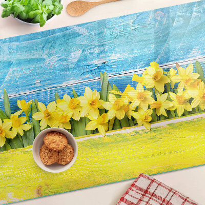 Glass kitchen board Daffodil flowers against the sky