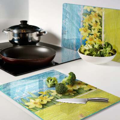 Glass kitchen board Daffodil flowers against the sky