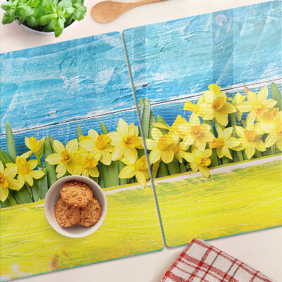 Glass kitchen board Daffodil flowers against the sky