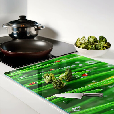 Glass chopping board Water drops on grass with ladybugs