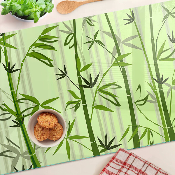 Glass kitchen board Bamboo on a green background