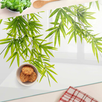 Chopping board Bamboo leaves against the window background