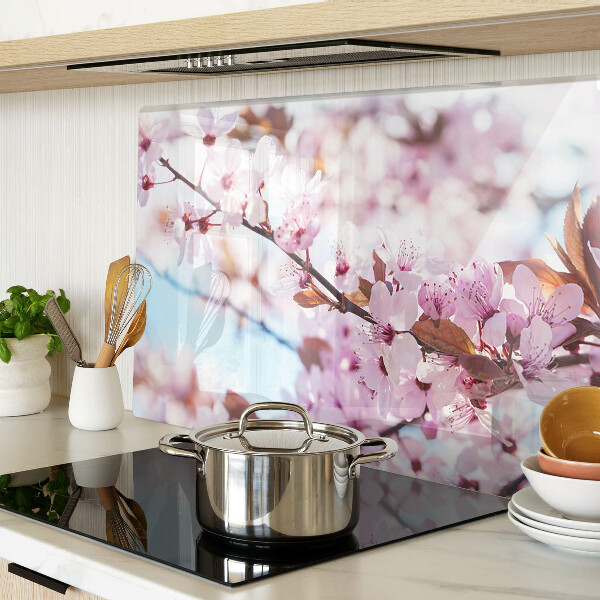Glass chopping board Cherry blossoms on a blue background