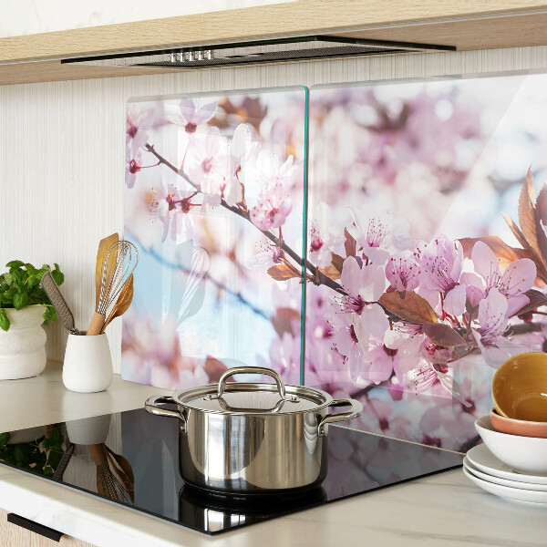 Glass chopping board Cherry blossoms on a blue background