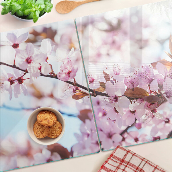 Glass chopping board Cherry blossoms on a blue background