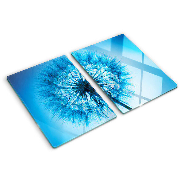 Chopping board glass Dandelion on a blue background