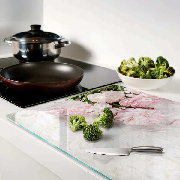 Glass cutting board Peony flowers on a marble background