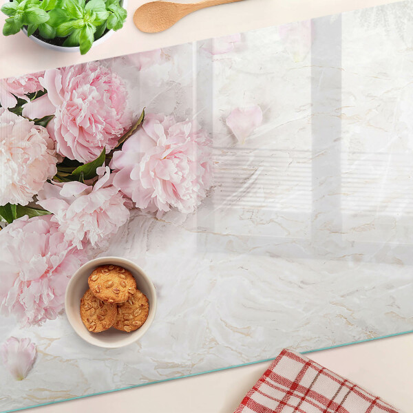 Glass cutting board Peony flowers on a marble background