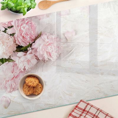 Glass cutting board Peony flowers on a marble background