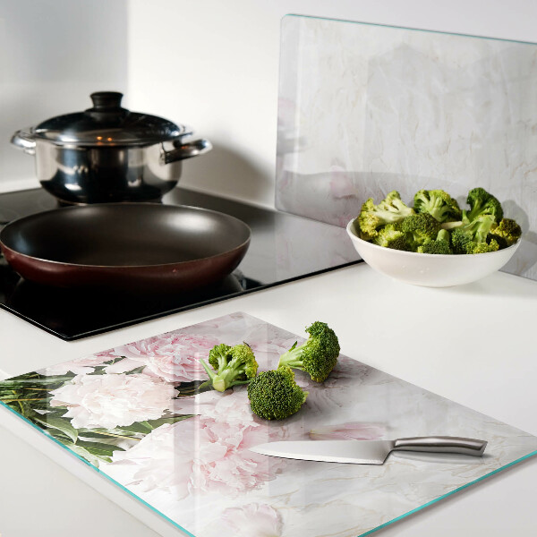 Glass cutting board Peony flowers on a marble background