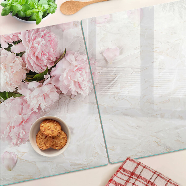 Glass cutting board Peony flowers on a marble background