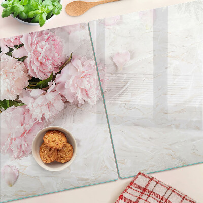 Glass cutting board Peony flowers on a marble background