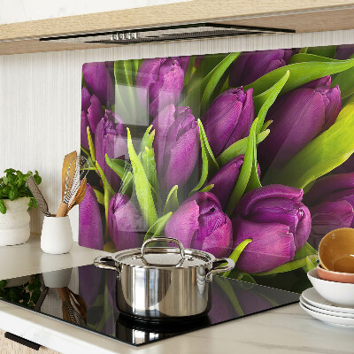 Glass kitchen board Purple tulips with green leaves