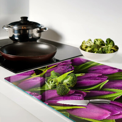 Glass kitchen board Purple tulips with green leaves